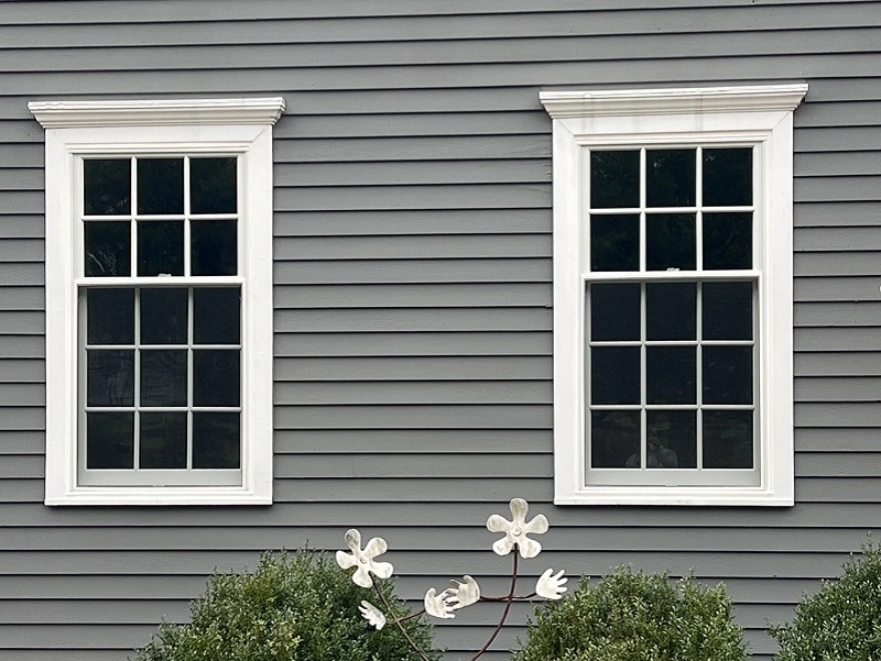 Colonial style double hung window with crown molding